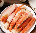 Cooked king crab legs on ice